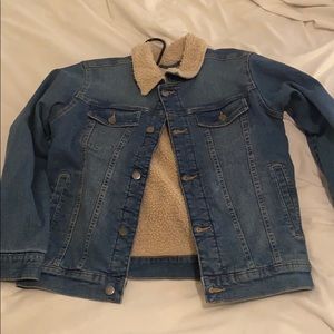 Wool lined jean jacket with insulated sleeves.